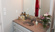 The repainted vanity with updated counter top and hardware looks brand new!